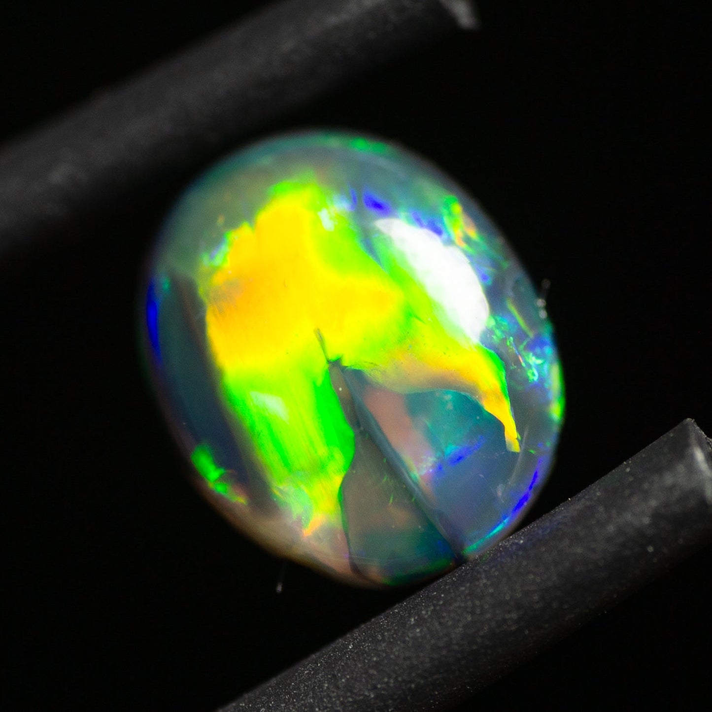 0.77 Carat Black Opal Oval Cabochon From Lightning Ridge Australia - Redpoint Jewelry