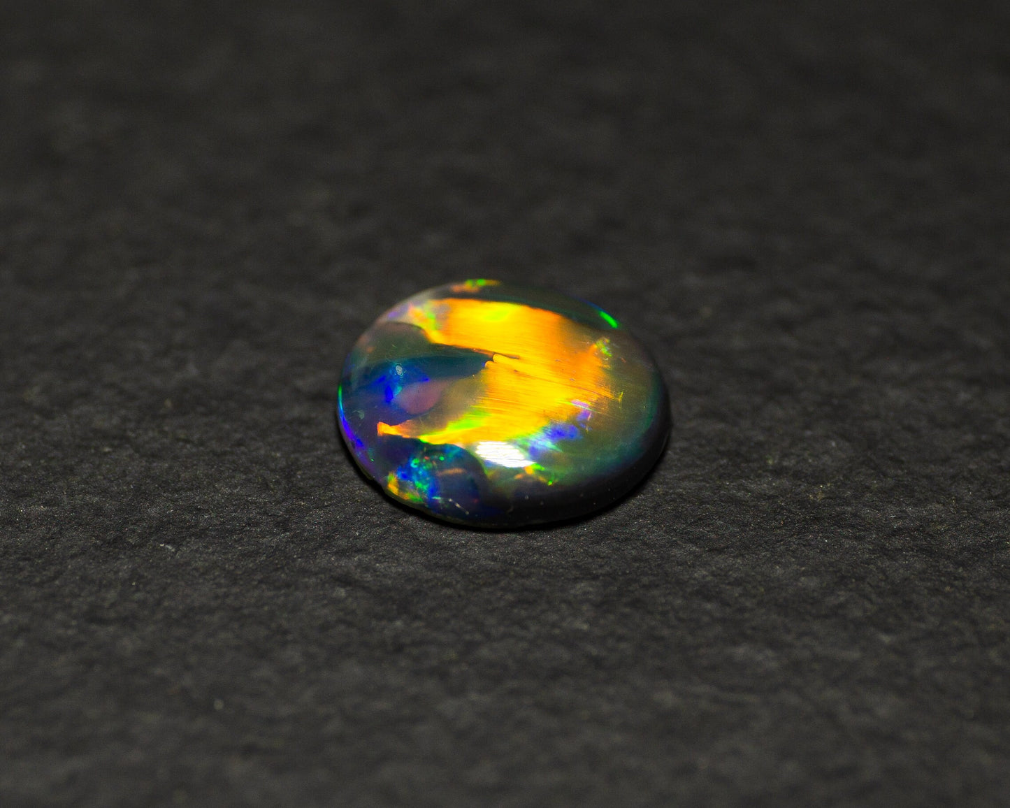 0.77 Carat Black Opal Oval Cabochon From Lightning Ridge Australia - Redpoint Jewelry