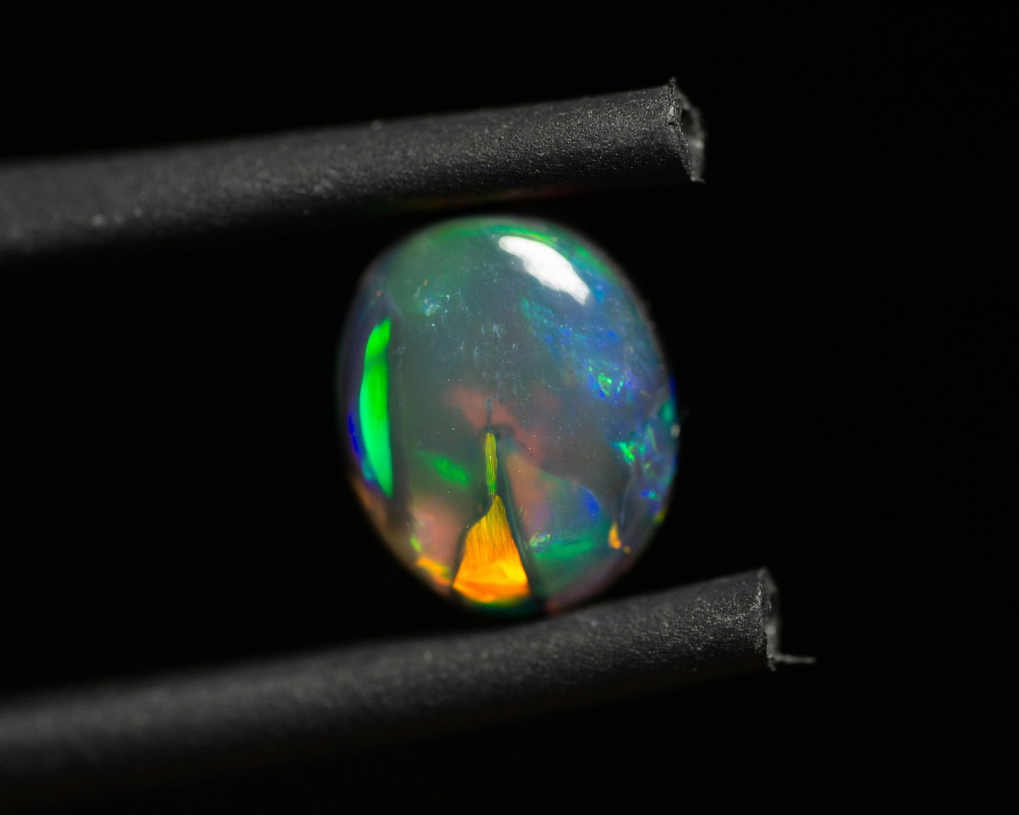 0.77 Carat Black Opal Oval Cabochon From Lightning Ridge Australia - Redpoint Jewelry