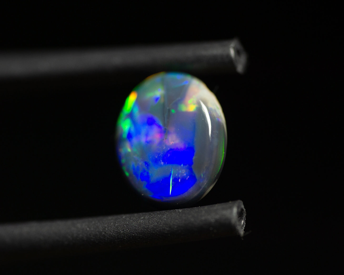 0.77 Carat Black Opal Oval Cabochon From Lightning Ridge Australia - Redpoint Jewelry