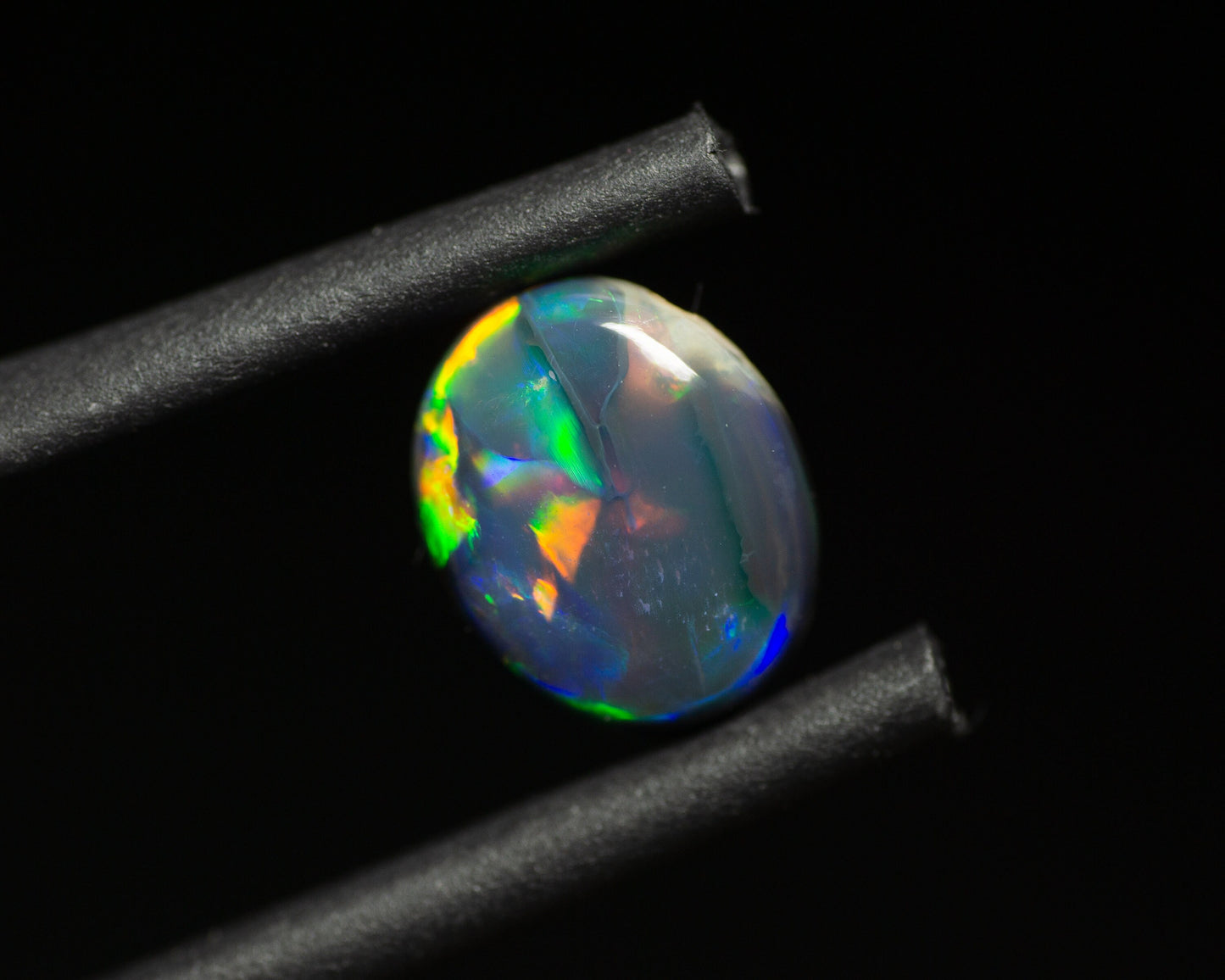 0.77 Carat Black Opal Oval Cabochon From Lightning Ridge Australia - Redpoint Jewelry