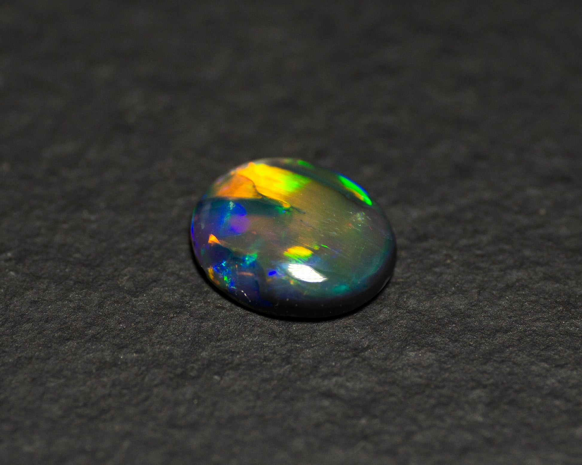 0.77 Carat Black Opal Oval Cabochon From Lightning Ridge Australia - Redpoint Jewelry 