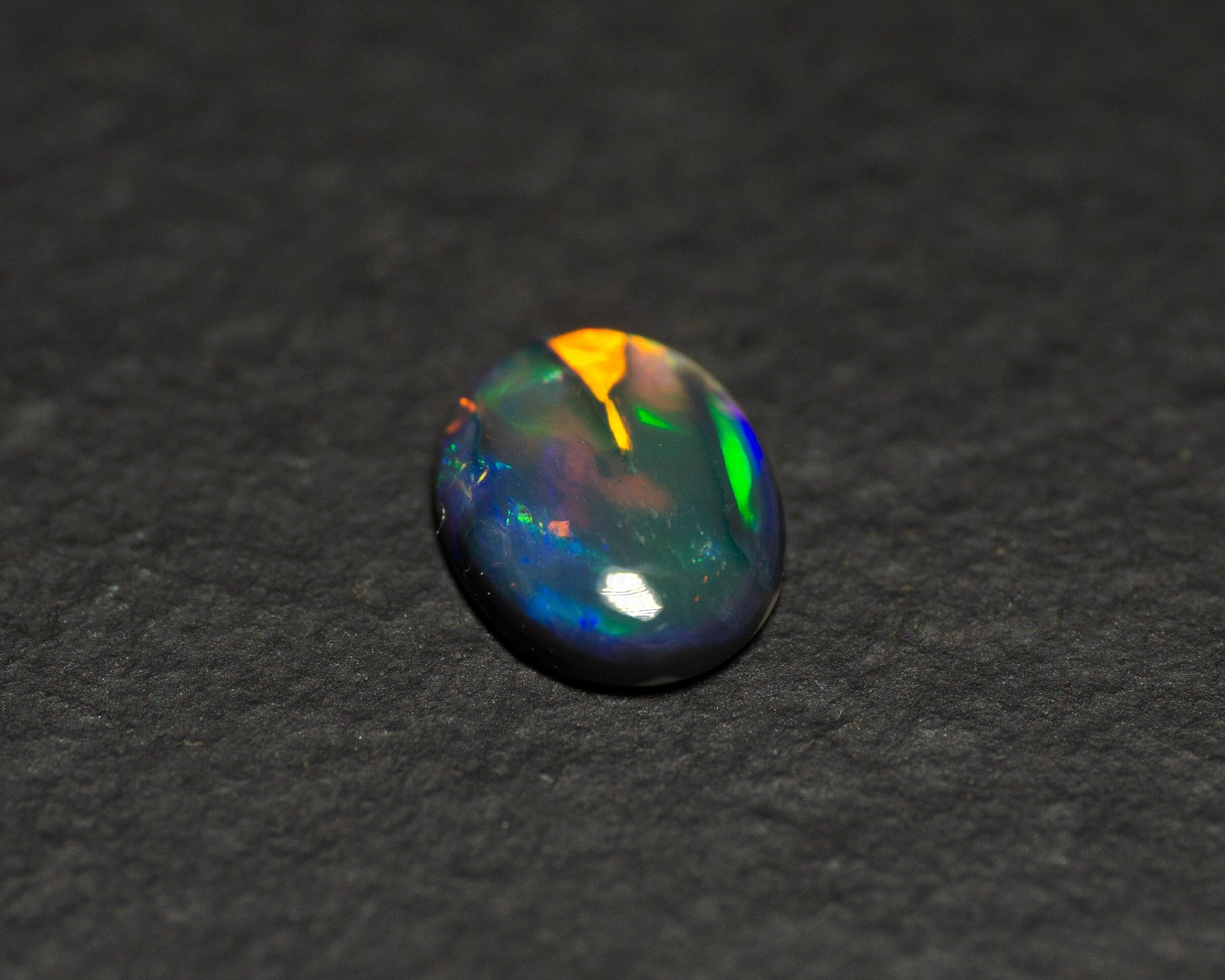 0.77 Carat Black Opal Oval Cabochon From Lightning Ridge Australia - Redpoint Jewelry 