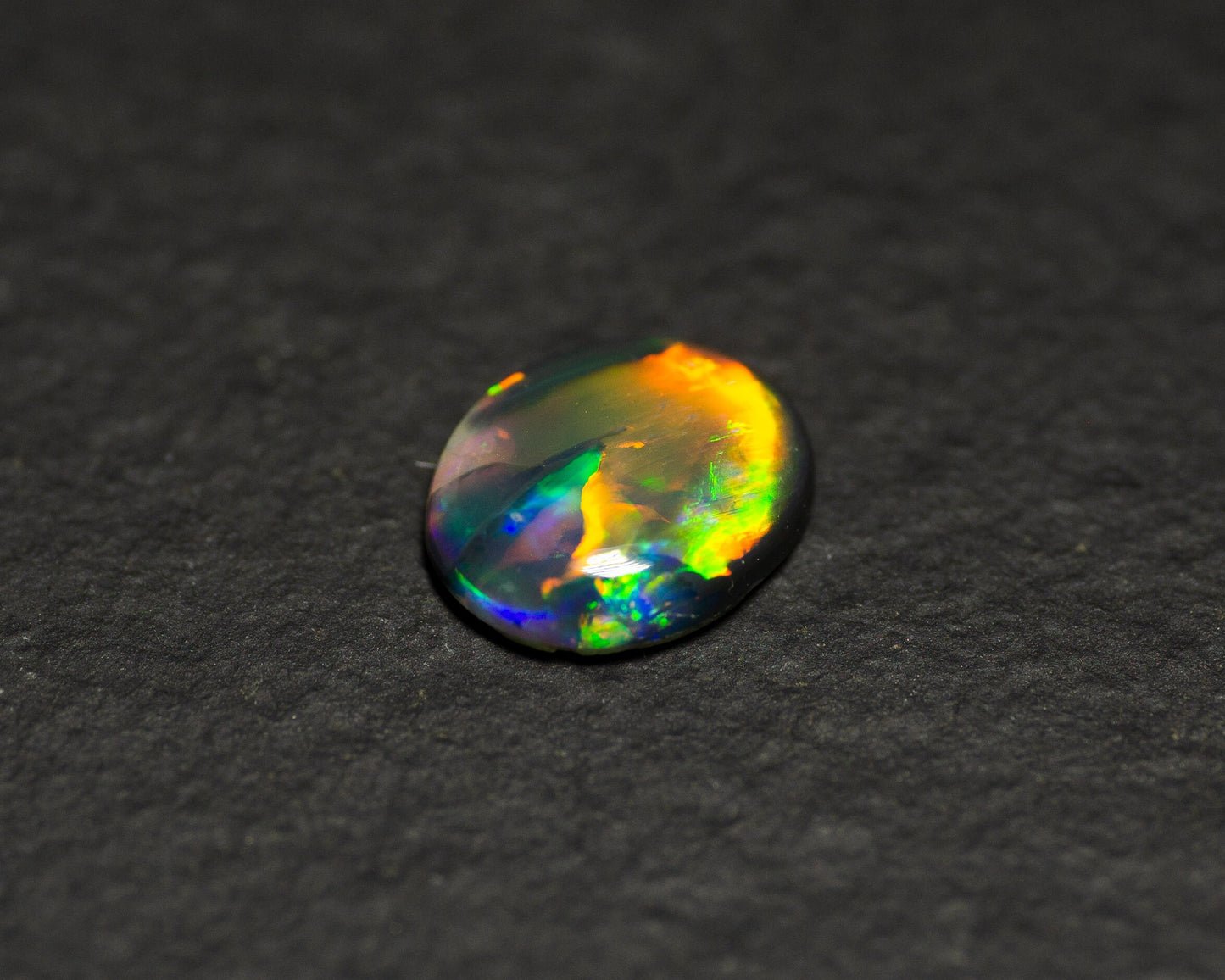 0.77 Carat Black Opal Oval Cabochon From Lightning Ridge Australia - Redpoint Jewelry 