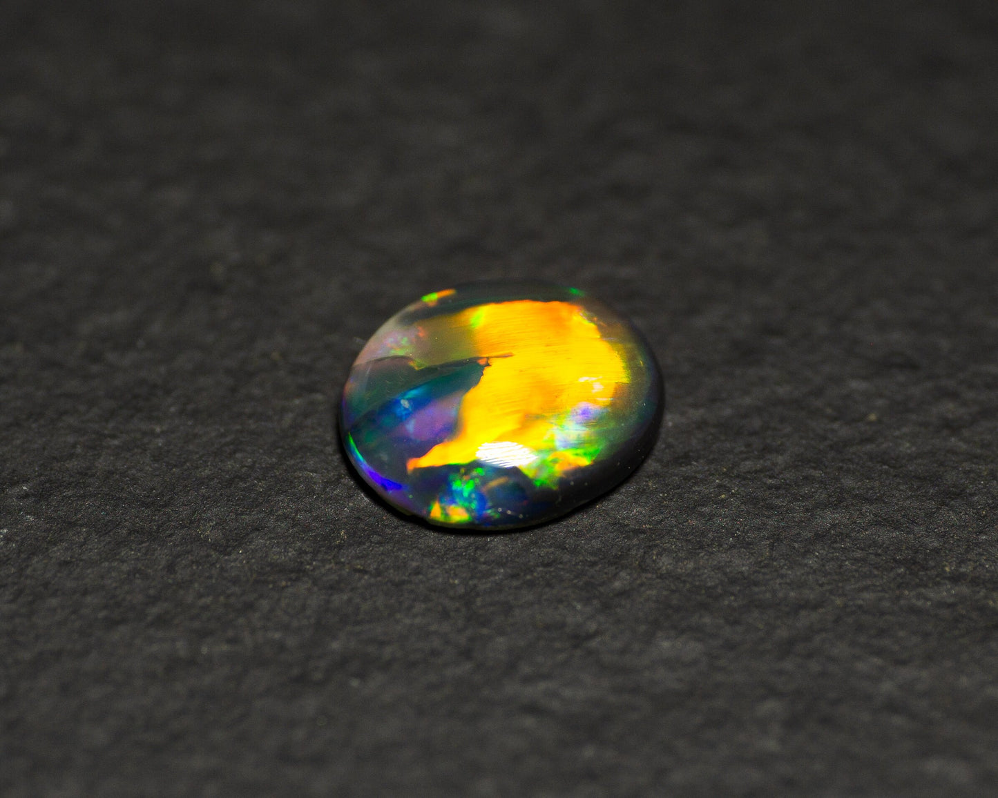 0.77 Carat Black Opal Oval Cabochon From Lightning Ridge Australia - Redpoint Jewelry 